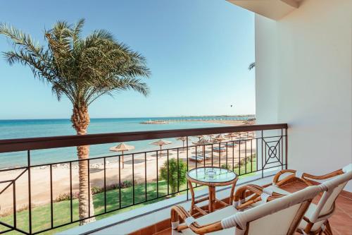 a balcony with a view of the beach at Sunrise Alma Bay Resort in Hurghada