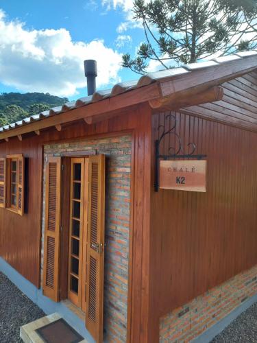 a building with a sign that says church me at Chalés Altos Da Montanha -K2 in Bom Jardim da Serra