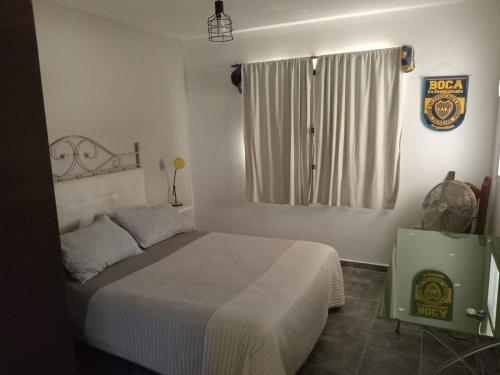 En eller flere senge i et værelse på La Casita de Nala