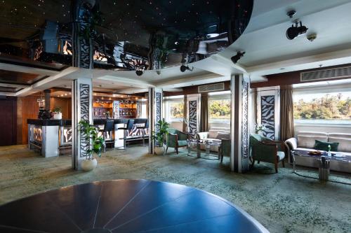 a dining room with a table and chairs at M/S Esmeralda Nile Cruise - 4 or 7 Nights From Luxor each Monday and 03 Nights From Aswan each Friday in Luxor
