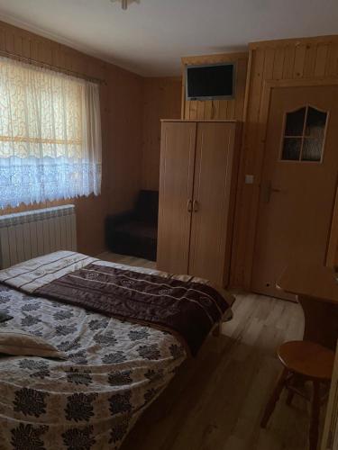 Ein Bett oder Betten in einem Zimmer der Unterkunft Agroturystyka Zdzisława i Kazimierz Remiasz