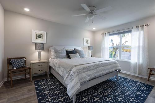 a bedroom with a large bed and a window at Bama Breeze in Foley