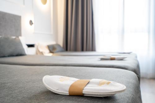 Postel nebo postele na pokoji v ubytování Hotel Conqueridor