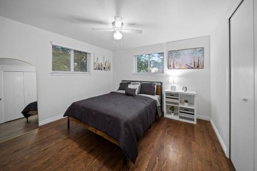 a bedroom with a bed and a ceiling fan at Charming Urban Retreat in Downtown Birmingham in Birmingham