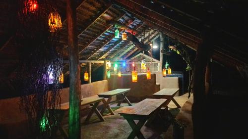 a patio with benches and lights in a building at Elephant Lake Villa, Yoga & Meditation Sanctuary in Sigiriya