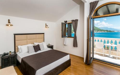 Postel nebo postele na pokoji v ubytování Boutique Hotel Kredo
