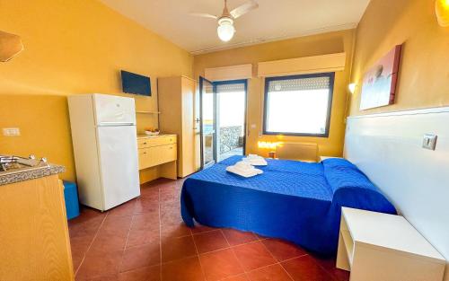 Кровать или кровати в номере Residence Hotel La Pelosetta