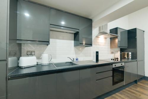 Kuchyň nebo kuchyňský kout v ubytování Harrisons Aparthotel Liverpool