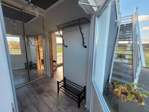 a room with a glass door and a stair case at Domek na Pagórku in Lwówek Śląski