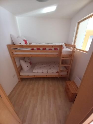 a small room with two bunk beds in it at Haus am Waldrand in Thiersee