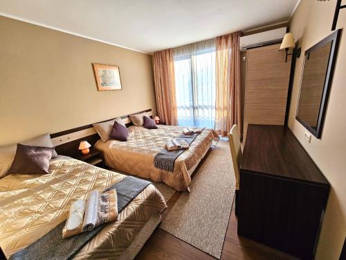 מיטה או מיטות בחדר ב-Suite in Dream Bansko