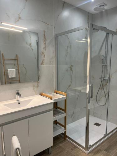 a bathroom with a shower and a sink at ORM- Flores Apartment in Porto