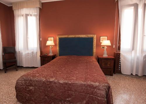 Ένα ή περισσότερα κρεβάτια σε δωμάτιο στο Hotel Guerrato