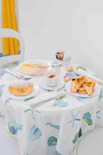 a table with plates of food on it at La Casa di Aurora in Maiori