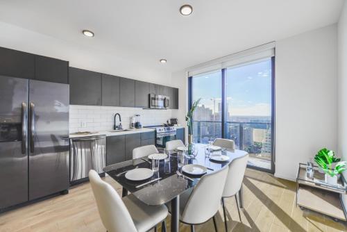 a kitchen and dining room with a table and chairs at Luxury Apt with Amazing City Views All of Miami in Miami