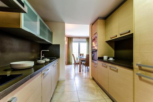 a kitchen with a sink and a counter top at El Plantío Golf Resort in Alicante