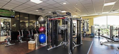 a gym with a lot of equipment in a room at Westgate Towers Resort in Orlando