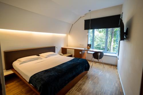 Postel nebo postele na pokoji v ubytování Black Hotel