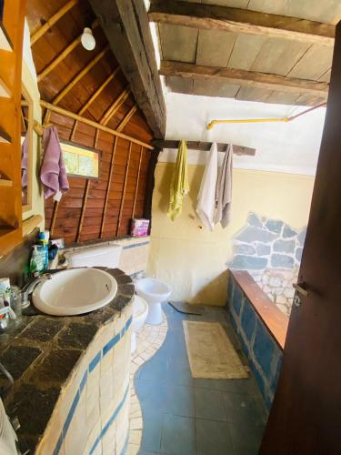 a bathroom with a sink and a toilet at El Hobbit in Villa General Belgrano