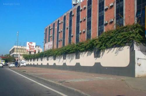 a building with plants on the side of a street at STOP TIME HOTE in Rio de Janeiro