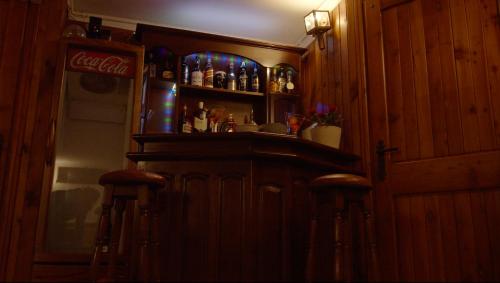 a bar in a room with a cocacola refrigerator at Villa Mase in Ravenna