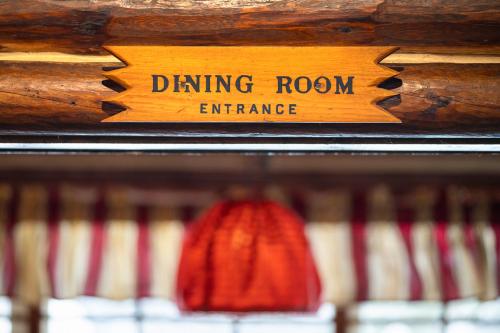 a sign that says dancing room entrance on a shelf at Storm Mountain Lodge & Cabins in Banff