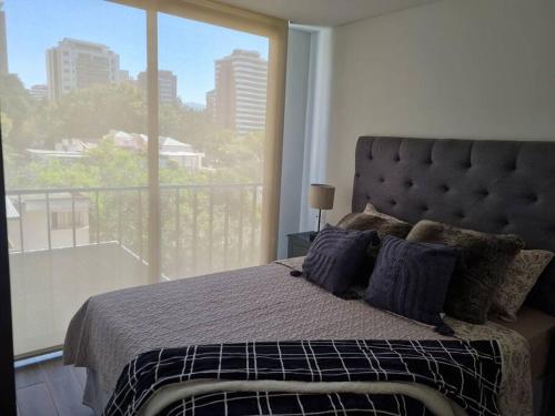 Кровать или кровати в номере Apartamento de Lujo