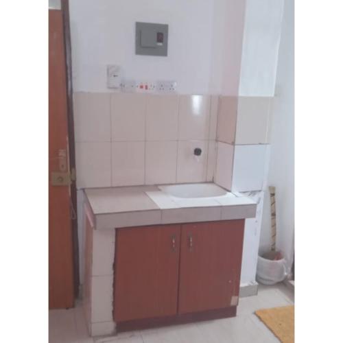 a small kitchen with a sink and a counter at STUX HOMES in Mombasa
