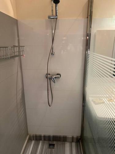 a shower in a bathroom with a shower head at Superbe appartement proche de toutes les commodité in Rabat