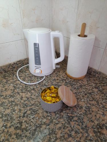 a blender and a bowl of food on a counter at GÜEMES in Mar del Plata