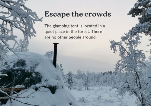 a snow covered forest with the words escape the crowds at Arctic Nature Experience Glamping in Vuontisjärvi