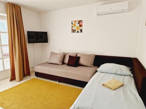 Ένα ή περισσότερα κρεβάτια σε δωμάτιο στο Balaton Apartman Füred