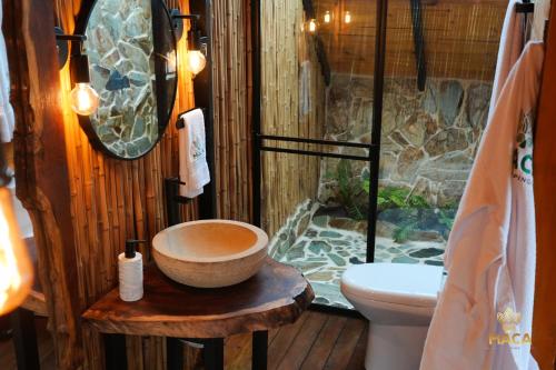 a bathroom with a sink and a toilet and a shower at MACA GLAMPING in Calima