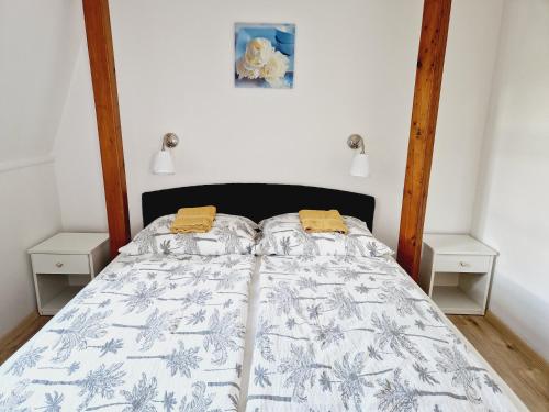Ένα ή περισσότερα κρεβάτια σε δωμάτιο στο Balaton Apartman Füred