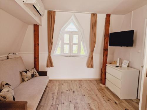 Ένα ή περισσότερα κρεβάτια σε δωμάτιο στο Balaton Apartman Füred