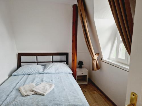 Ένα ή περισσότερα κρεβάτια σε δωμάτιο στο Balaton Apartman Füred