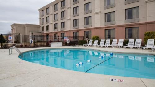 a large swimming pool in front of a hotel at BridgePointe Hotel & Marina in New Bern