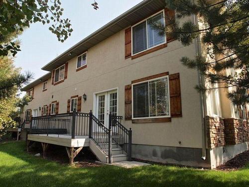 a house with a staircase in front of it at Union Park in Salt Lake with Hot Tub Near Park in Midvale