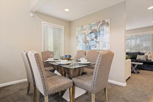 a dining room with a table and chairs at Union Duplex in Salt Lake with Hot Tub and Park in Midvale