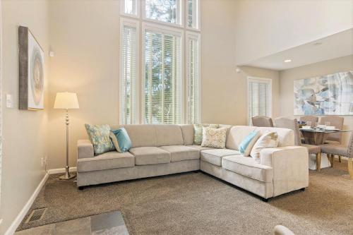 a living room with a couch and a table at Union Duplex in Salt Lake with Hot Tub and Park in Midvale