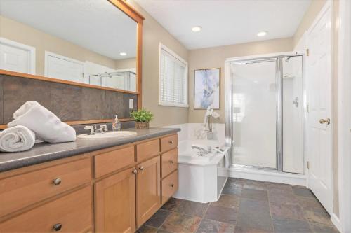 a bathroom with a shower and a toilet and a sink at Union Duplex in Salt Lake with Hot Tub and Park in Midvale