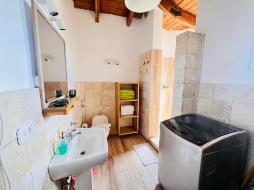 a bathroom with a sink and a toilet at Paraíso Bayahibe in Bayahibe