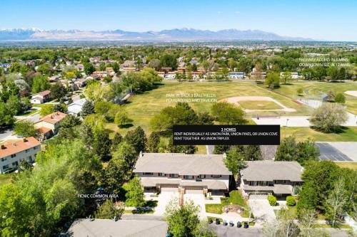 an aerial view of a school campus with mountains in the background at Union Cove 3-Plex in Salt Lake with Hot Tub in Midvale