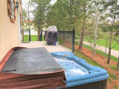 a swimming pool with a cover on a deck at Union Cove 3-Plex in Salt Lake with Hot Tub in Midvale