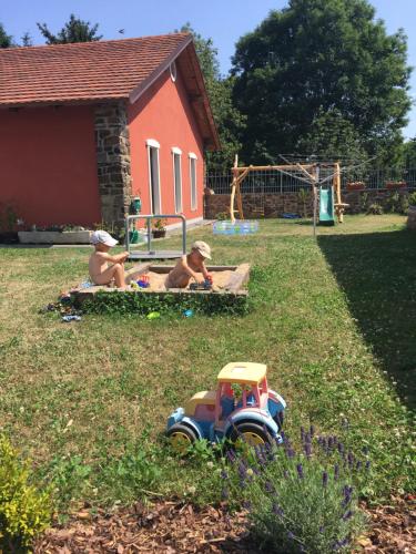 two boys playing in a yard with a toy truck at Usedlost Horka Onšov in Onšov