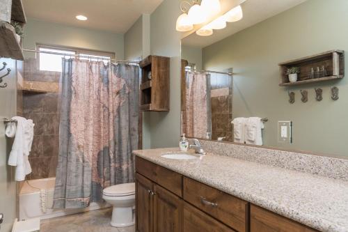 a bathroom with a sink and a toilet and a shower at 3| Grand View Estate in St George with Views and Lawn in Santa Clara