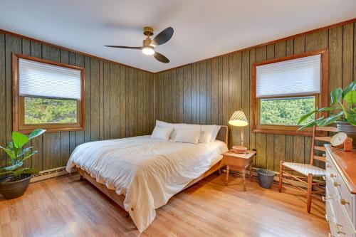 a bedroom with a bed and a ceiling fan at Vacation Rental Home about 2 Mi to Windham Mountain! in Windham