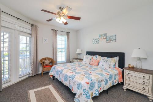 a bedroom with a bed and a ceiling fan at Seaside at Anastasia C203 in St. Augustine