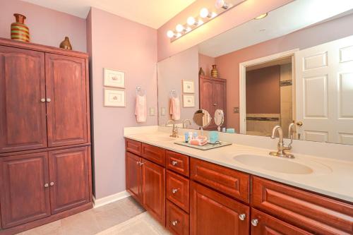a bathroom with a sink and a large mirror at Seaside at Anastasia C203 in St. Augustine