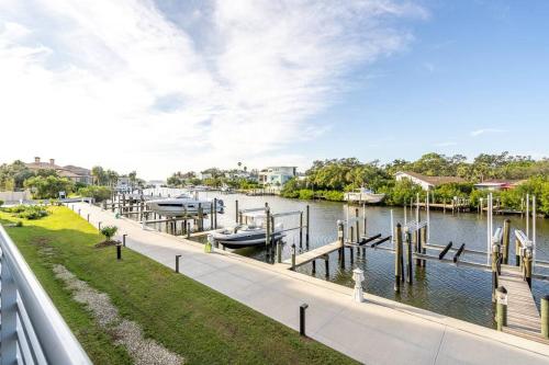 a marina with boats in the water at Waterside Retreat: Modern 2BR, Mins to Beach & Apt in Sarasota